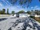 Charming single-story home with a paved driveway and well-maintained landscaping under a blue sky at 4619 Helena Ne St, St Petersburg, FL 33703