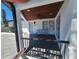 Inviting covered front porch with stained wood ceiling, fan, and charming front door at 4619 Helena Ne St, St Petersburg, FL 33703