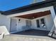 Charming covered front porch with stained wood ceiling, fan, and double glass doors at 4619 Helena Ne St, St Petersburg, FL 33703