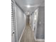 Long hallway features wood-look floors and neutral paint at 4619 Helena Ne St, St Petersburg, FL 33703