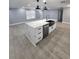 Bright kitchen with an island, stainless steel appliances, and hardwood flooring at 4619 Helena Ne St, St Petersburg, FL 33703
