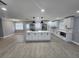 Bright open kitchen with an island, stainless steel appliances, and white cabinets at 4619 Helena Ne St, St Petersburg, FL 33703