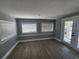 Bright living room with wood-look floors and neutral paint at 4619 Helena Ne St, St Petersburg, FL 33703