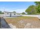 Expansive backyard with well-maintained lawn and privacy fence, ideal for outdoor enjoyment at 4727 W Wisconsin Ave, Tampa, FL 33616