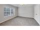 Bedroom featuring neutral walls, carpet, and a window to provide natural light at 4920 Pond Ridge Dr, Riverview, FL 33578