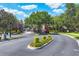 Community entrance to Valhalla, with manicured landscaping and gated access for security at 4920 Pond Ridge Dr, Riverview, FL 33578