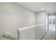 Upstairs hallway featuring neutral paint, carpet, and bright natural light from nearby window at 4920 Pond Ridge Dr, Riverview, FL 33578