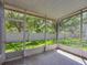 Enjoy the outdoors in this screened patio with a view of the green backyard at 4920 Pond Ridge Dr, Riverview, FL 33578