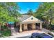 Pool house featuring shaded seating areas and attractive architectural details at 4920 Pond Ridge Dr, Riverview, FL 33578