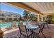 Relaxing pool area with comfortable lounge chairs and tables, perfect for outdoor enjoyment at 4920 Pond Ridge Dr, Riverview, FL 33578
