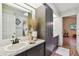 Bathroom featuring granite counters, ample cabinet space, and updated fixtures at 506 Crystal Grove Blvd, Lutz, FL 33548