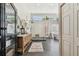 Modern bathroom offers a glass-enclosed shower, dual vanity, soaking tub, and black tiled flooring at 506 Crystal Grove Blvd, Lutz, FL 33548