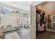 Bathroom with a walk-in shower and freestanding tub, leading into a spacious walk-in closet at 506 Crystal Grove Blvd, Lutz, FL 33548