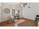 Inviting bedroom with vaulted ceiling, wood floors, and a cozy seating area at 506 Crystal Grove Blvd, Lutz, FL 33548