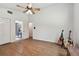 Bedroom with high ceilings, wood floors, and natural light, ready for personalization at 506 Crystal Grove Blvd, Lutz, FL 33548
