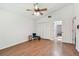 Bedroom with vaulted ceilings and wood floors, featuring ample closet space and natural light at 506 Crystal Grove Blvd, Lutz, FL 33548