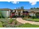 Inviting front entrance with decorative plants, fountain, and brick pathway at 506 Crystal Grove Blvd, Lutz, FL 33548