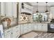 Bright kitchen features custom cabinetry, granite countertops, and stainless steel appliances at 506 Crystal Grove Blvd, Lutz, FL 33548