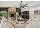 Spacious living room offers vaulted ceilings, custom fireplace, and shelving for ample storage at 506 Crystal Grove Blvd, Lutz, FL 33548