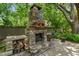Stone outdoor fireplace area, ideal for outdoor gatherings and cozy evenings at 506 Crystal Grove Blvd, Lutz, FL 33548