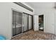 Enclosed patio with brick floor, sliding glass doors to pool, and adjacent half bath at 506 Crystal Grove Blvd, Lutz, FL 33548