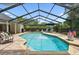 Sparkling private pool with a screened enclosure, surrounded by comfortable lounge seating at 506 Crystal Grove Blvd, Lutz, FL 33548