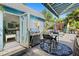 Charming backyard featuring a stainless steel grill, outdoor seating, pool, and tropical landscaping at 5127 29Th S Ave, Gulfport, FL 33707