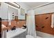 Bathroom featuring decorative tile, single sink vanity, and shower with bathtub at 5127 29Th S Ave, Gulfport, FL 33707