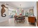 Elegant dining area with modern lighting and stylish decor adjacent to the living room at 5127 29Th S Ave, Gulfport, FL 33707