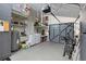 Spacious garage features a washer, dryer, wash basin, shelving for storage and gray garage door at 5127 29Th S Ave, Gulfport, FL 33707