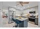 Bright kitchen featuring an island with seating, stainless steel appliances and white subway tile backsplash at 5127 29Th S Ave, Gulfport, FL 33707