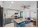 Updated kitchen features an island with bar seating, stainless steel appliances, and a breakfast nook at 5127 29Th S Ave, Gulfport, FL 33707