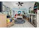 Comfortable living room with coastal decor, modern furniture, a decorative rug, and a mini fridge at 5127 29Th S Ave, Gulfport, FL 33707