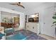 Bright living room flows to dining room with natural light and features modern furniture at 5127 29Th S Ave, Gulfport, FL 33707