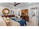 Well-lit main bedroom offers stylish decor, wood furnishings, and a relaxing atmosphere at 5127 29Th S Ave, Gulfport, FL 33707