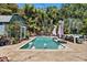 Backyard pool area surrounded by tropical landscaping, pavers, lounge furniture, and a cabana at 5127 29Th S Ave, Gulfport, FL 33707