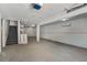 Spacious unfinished basement area features concrete flooring, stairs, and white-painted walls at 5413 N Park Pl, Tampa, FL 33603
