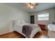 Well-lit bedroom showcases a ceiling fan, a window, and wood-look flooring at 5876 21St N St # 10, St Petersburg, FL 33714