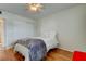 Stylish bedroom featuring hardwood floors, ceiling fan, and sliding closet doors at 5876 21St N St # 10, St Petersburg, FL 33714