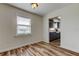 Bright dining room featuring stylish wood floors, white walls, and kitchen access at 5876 21St N St # 10, St Petersburg, FL 33714