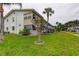 Well-maintained condo building with manicured lawn and palm trees, creating a serene setting at 5876 21St N St # 10, St Petersburg, FL 33714