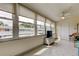 Relaxing sunroom area with tile floors and large windows providing ample natural light at 5876 21St N St # 10, St Petersburg, FL 33714