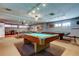 Spacious community game room featuring multiple pool tables and comfortable seating at 5876 21St N St # 10, St Petersburg, FL 33714