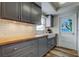 Updated kitchen with gray cabinetry, butcher block countertops, and stained-glass window at 5876 21St N St # 10, St Petersburg, FL 33714