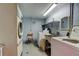 Functional laundry room with washing machines and a utility sink at 5876 21St N St # 10, St Petersburg, FL 33714