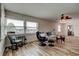 Inviting living room with lots of natural light, neutral paint, comfortable seating, and wood-look floors at 5876 21St N St # 10, St Petersburg, FL 33714