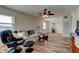 Cozy living room featuring a ceiling fan, neutral paint, comfortable seating, and wood-look floors at 5876 21St N St # 10, St Petersburg, FL 33714