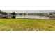 Community pond featuring a grassy area and well-maintained landscaping at 5876 21St N St # 10, St Petersburg, FL 33714