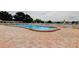 Outdoor community pool featuring a patio and multiple lounge chairs at 5876 21St N St # 10, St Petersburg, FL 33714
