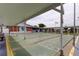 Shuffleboard courts with shaded seating areas at the recreation hall at 5876 21St N St # 10, St Petersburg, FL 33714